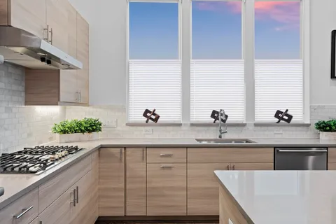 a kitchen with a sink and cabinets