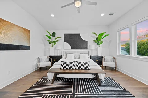 a bedroom with a bed and a chandelier