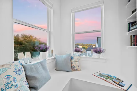 a spacious bathroom with a double vanity sink and a bathtub