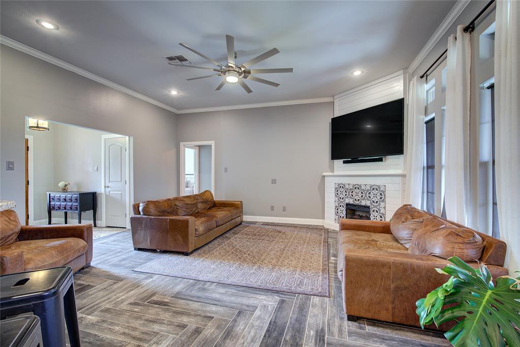 2027 Park Springs Road Sulphur Springs, TX 75482 - Photo 8 of 39 a living room with furniture and a flat screen tv