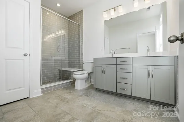 a bathroom with a sink double vanity and a mirror