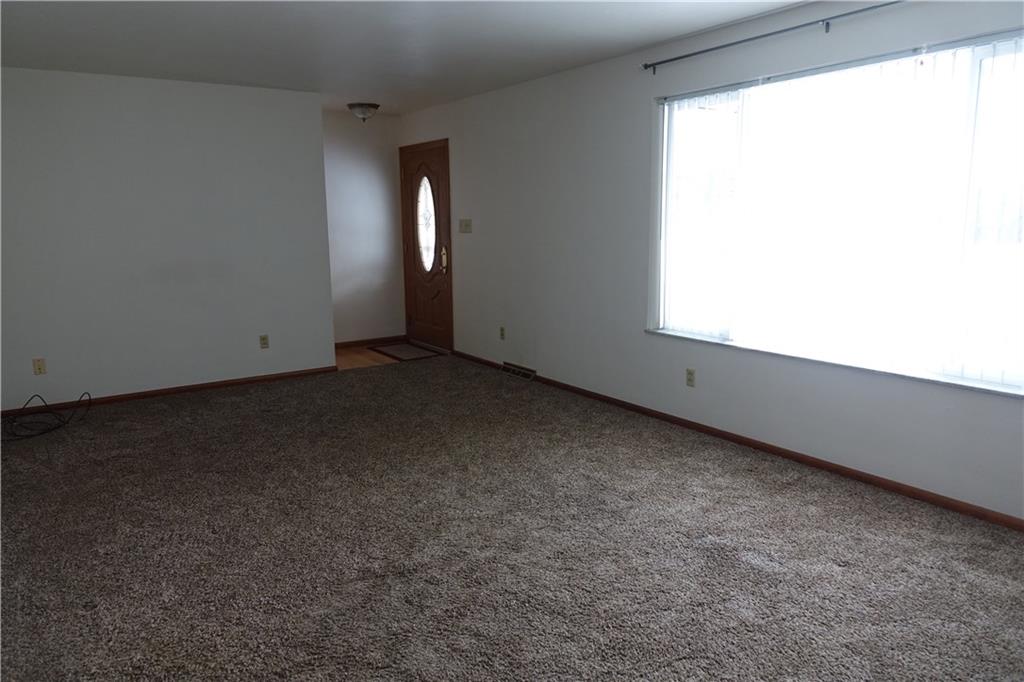420 Whitestown Road Butler, PA 16001 - Photo 4 of 22 Living Room with fireplace and newer carpeting