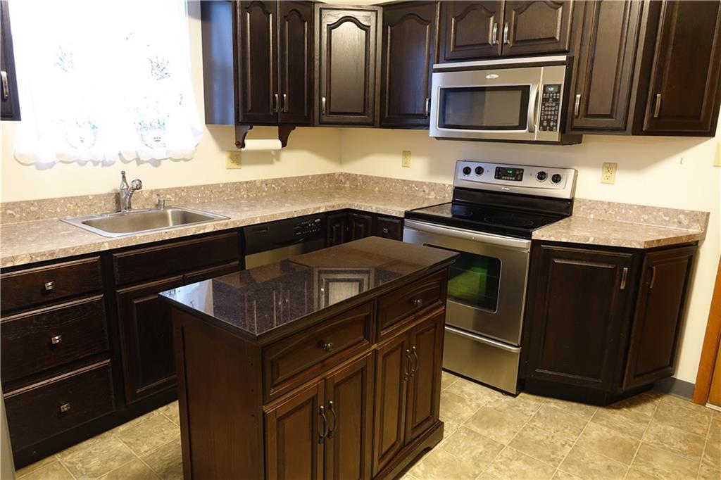420 Whitestown Road Butler, PA 16001 - Photo 6 of 22 Remodeled kitchen with stainless steel appliances and kitchen island