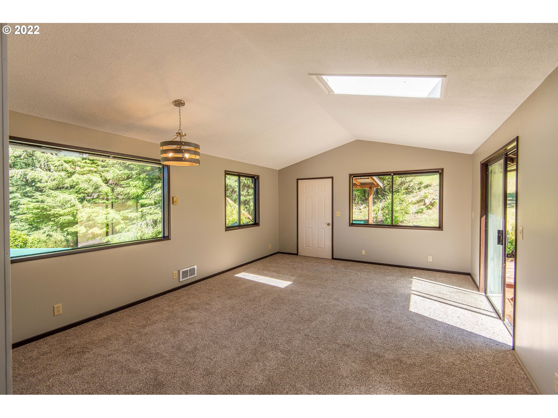 66001 Sunshine Road Coos Bay, OR 97420 - Photo 13 of 32 a view of an empty room with a window