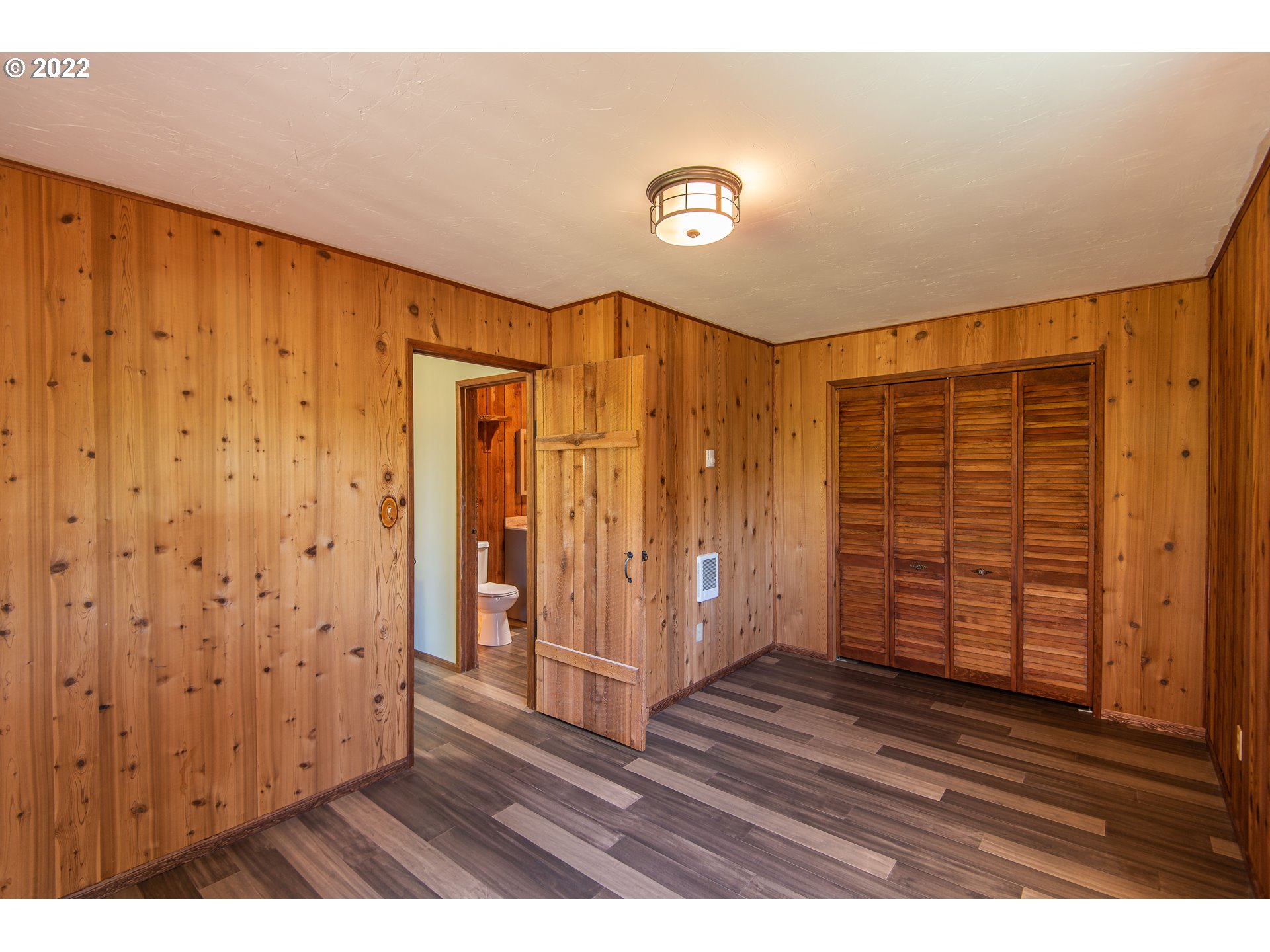 66001 Sunshine Road Coos Bay, OR 97420 - Photo 15 of 32 a view of an empty room with wooden floor