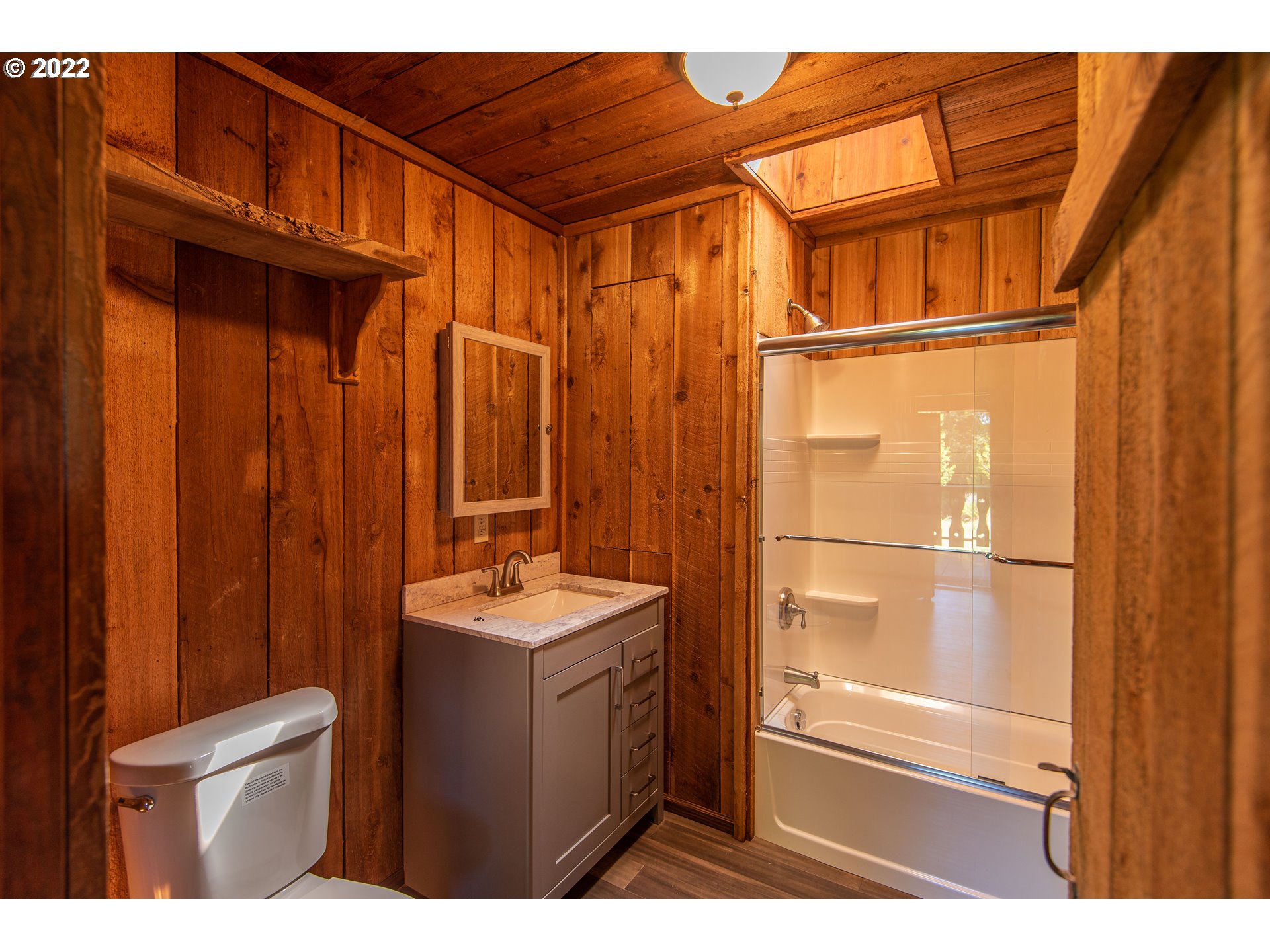 66001 Sunshine Road Coos Bay, OR 97420 - Photo 16 of 32 a bathroom with a sink a toilet and shower