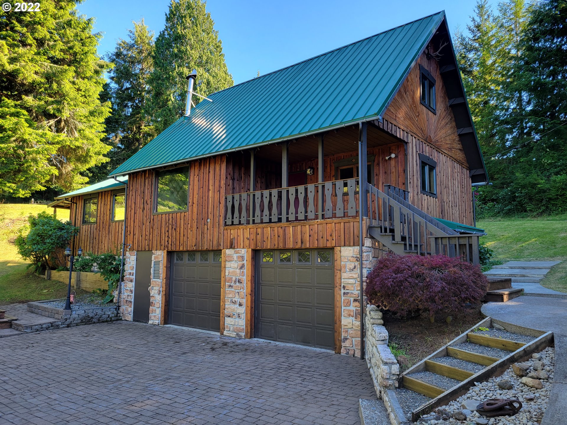 66001 Sunshine Road Coos Bay, OR 97420 - Photo 2 of 32 a front view of a house with garden