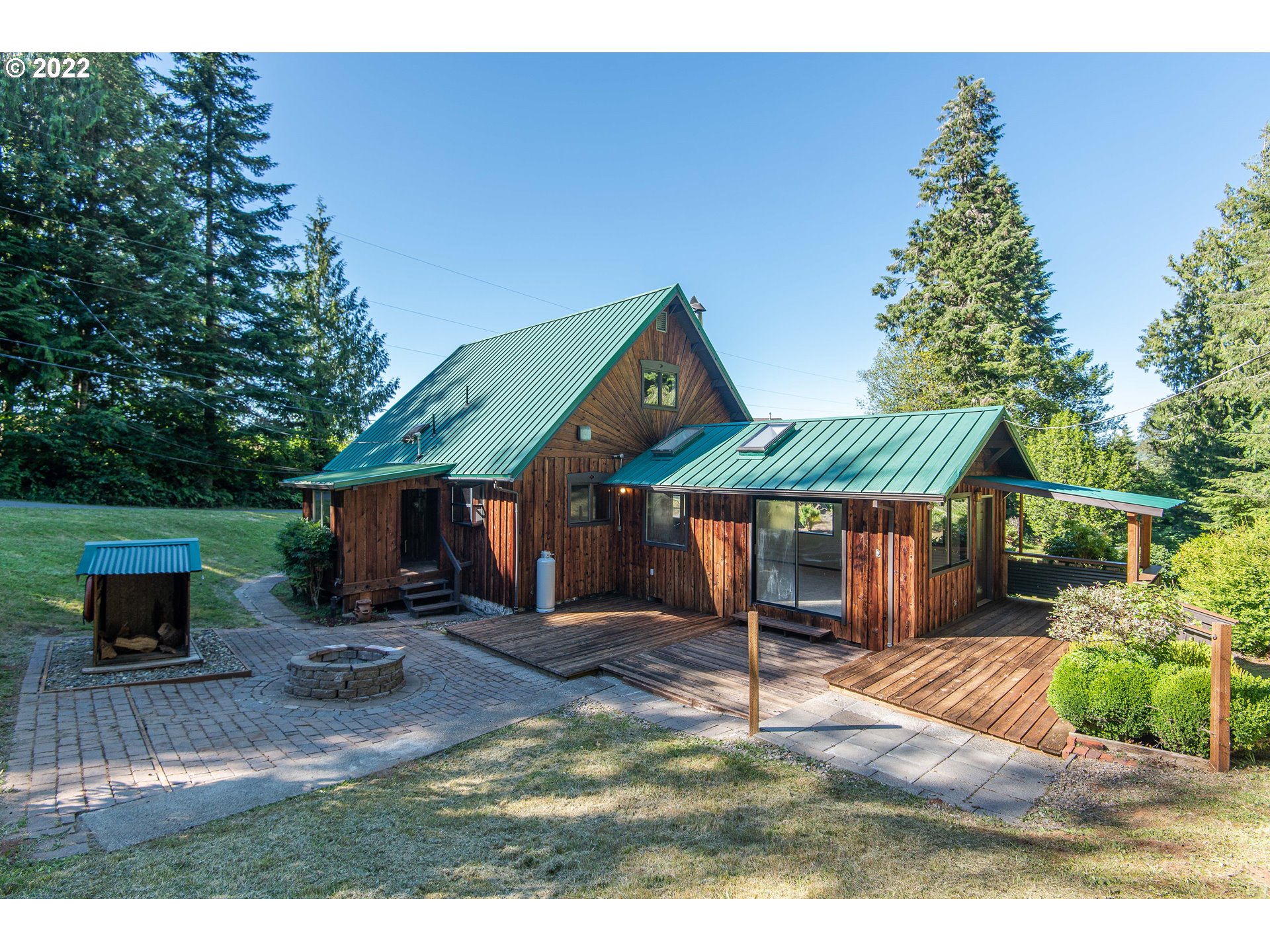 66001 Sunshine Road Coos Bay, OR 97420 - Photo 22 of 32 a view of a house with a yard