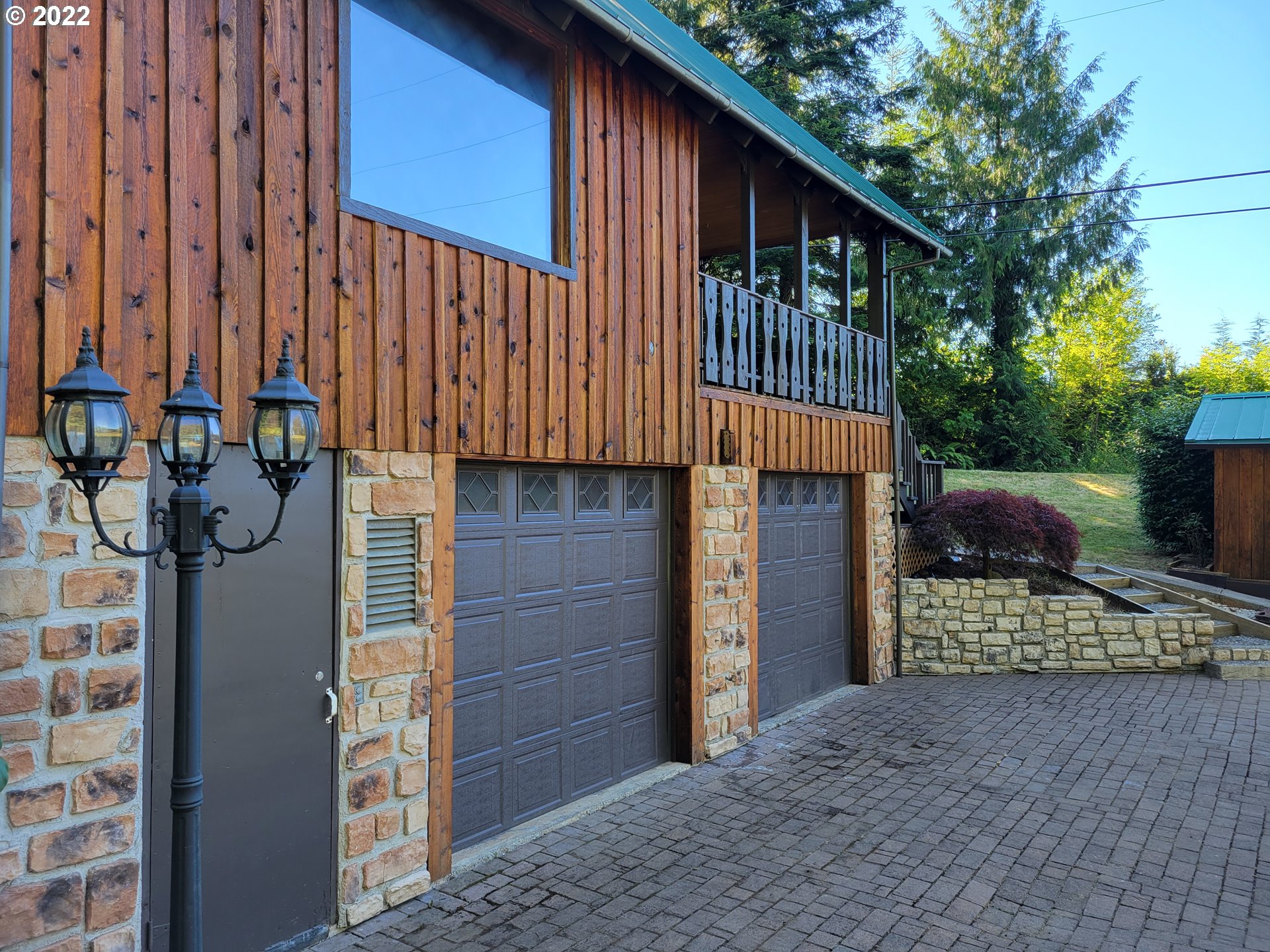 66001 Sunshine Road Coos Bay, OR 97420 - Photo 3 of 32 a front view of a house with a garage
