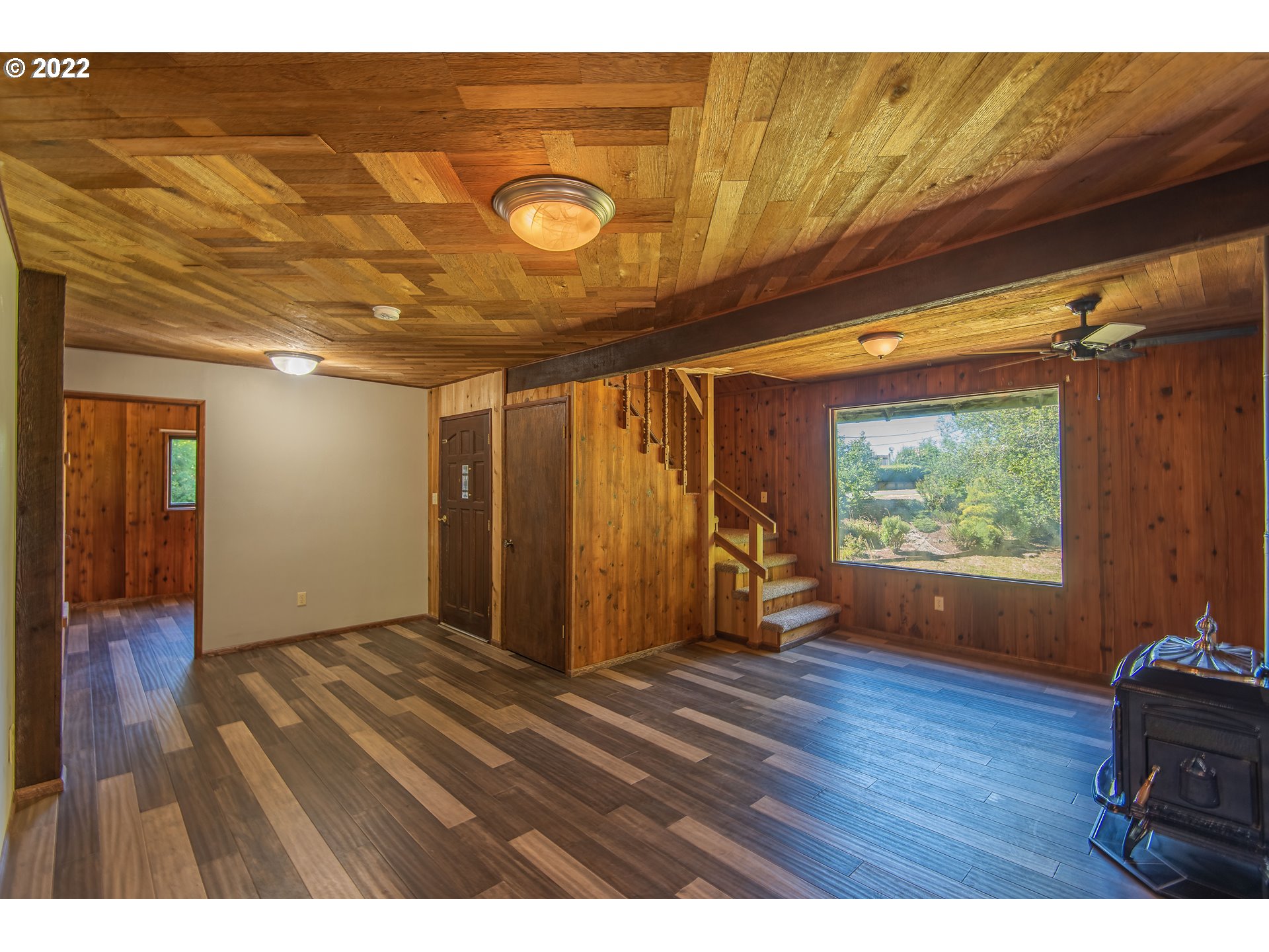 66001 Sunshine Road Coos Bay, OR 97420 - Photo 7 of 32 a view of empty room with wooden floor and fan