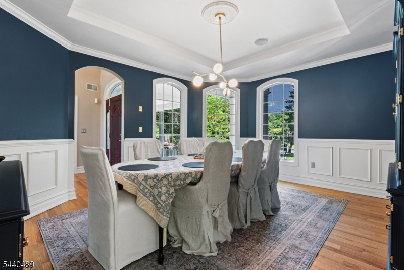 99 East Lindsley Road Cedar Grove, NJ 07009 - Photo 15 of 41 a view of a dining room with furniture window and wooden floor