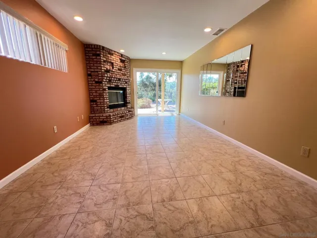a living room with fireplace