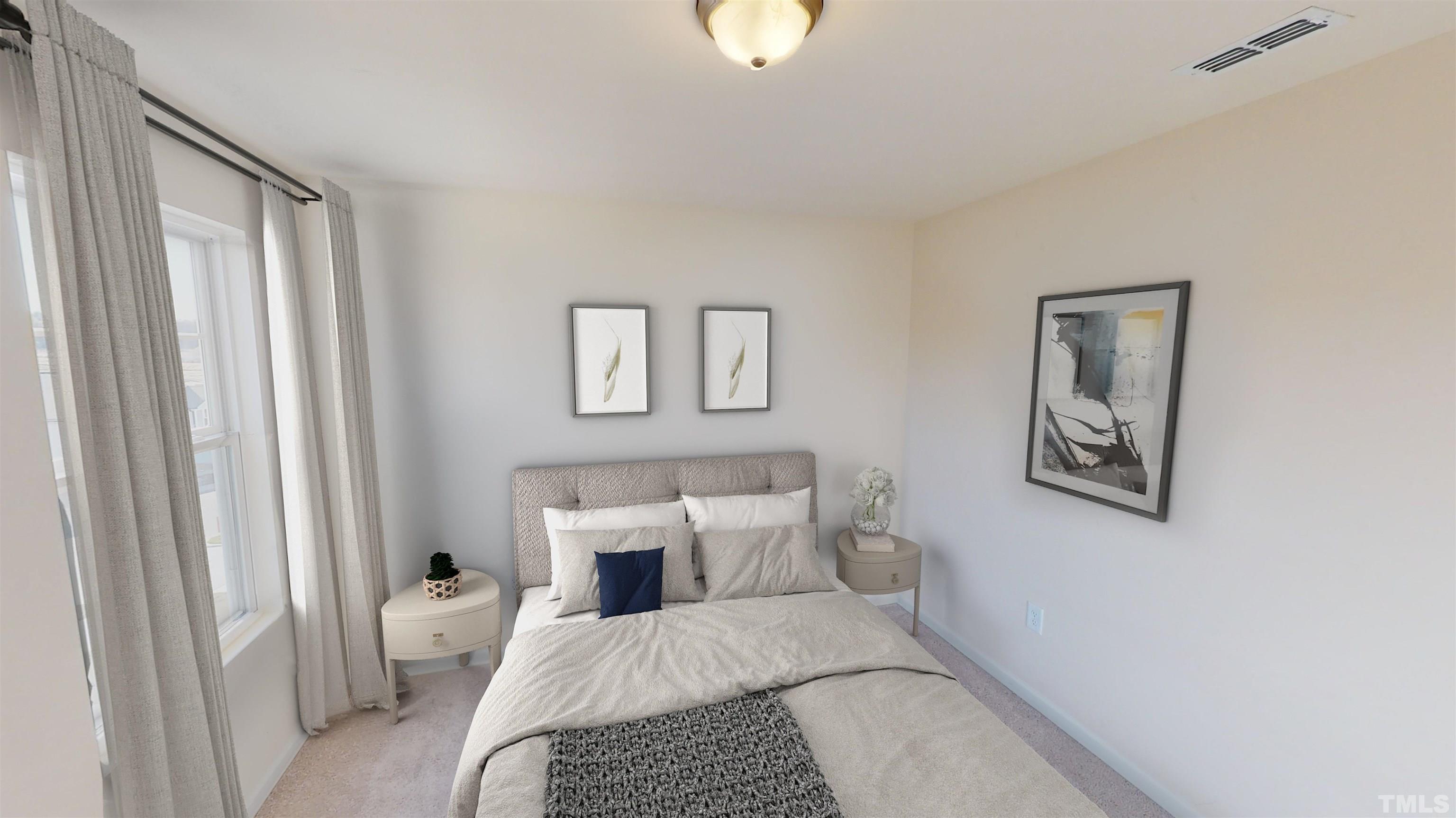 3473 Dragonfly River Court Raleigh, NC 27604 - Photo 18 of 26 a bedroom with a large bed and a couch