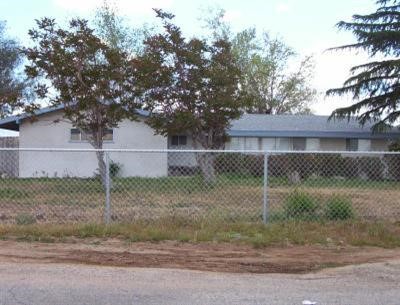 21021 Multnomah Road Apple Valley, CA 92308 - Photo 1 of 1 a backyard of a house