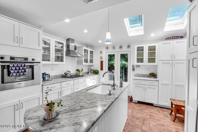 a kitchen with counter top space cabinets and appliances