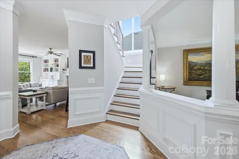 a view of a livingroom with furniture and staircase
