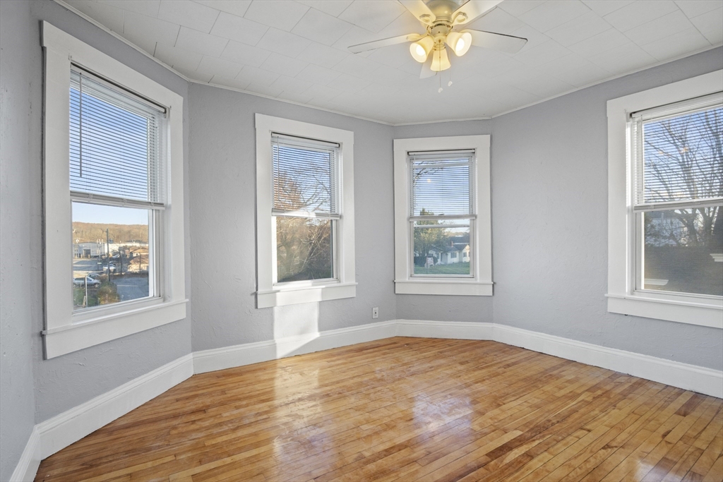 78 Greenwood Street Worcester, MA 01607 - Photo 11 of 33 a view of empty room with window and wooden floor
