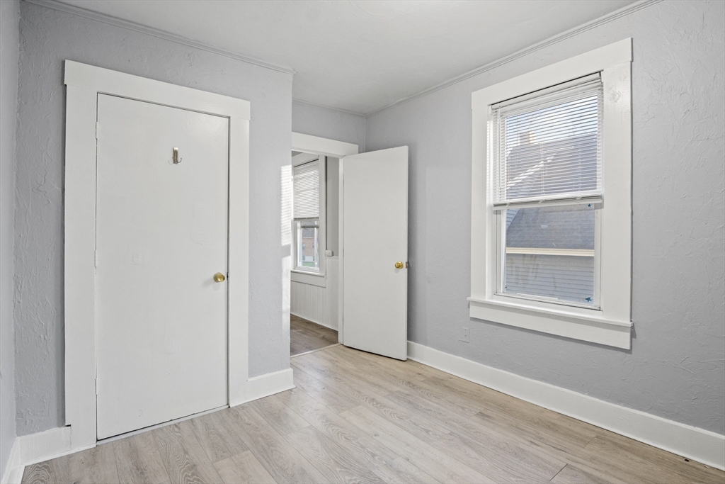 78 Greenwood Street Worcester, MA 01607 - Photo 13 of 33 a view of an empty room with wooden floor and a window