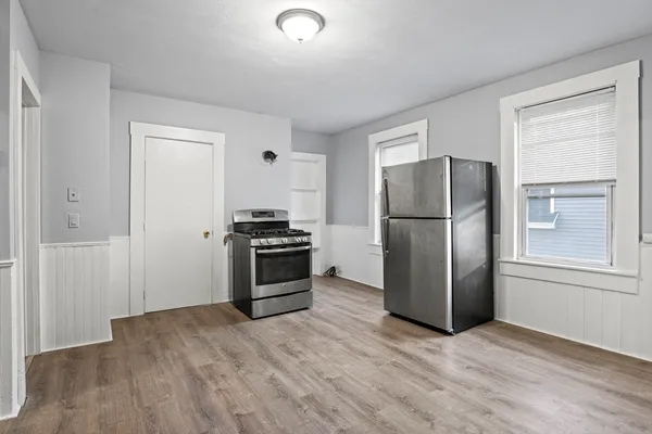 a kitchen with stainless steel appliances a refrigerator and a stove