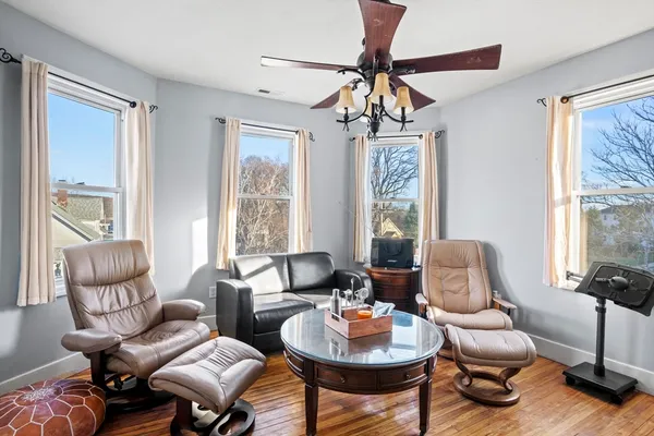 a living room with furniture and a large window