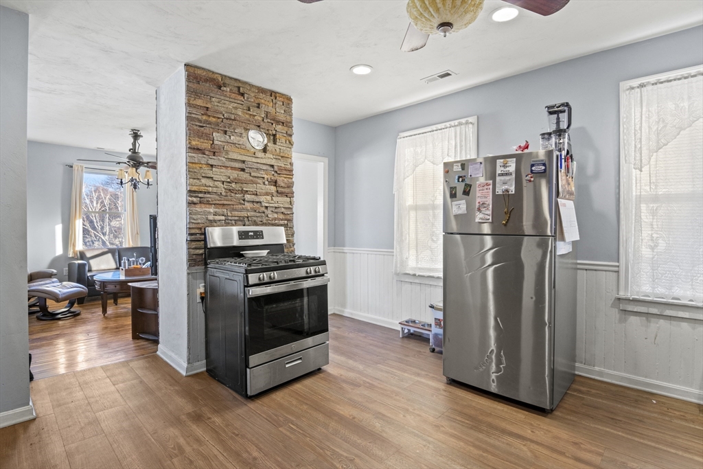 78 Greenwood Street Worcester, MA 01607 - Photo 28 of 33 a kitchen with stainless steel appliances granite countertop a refrigerator and a stove