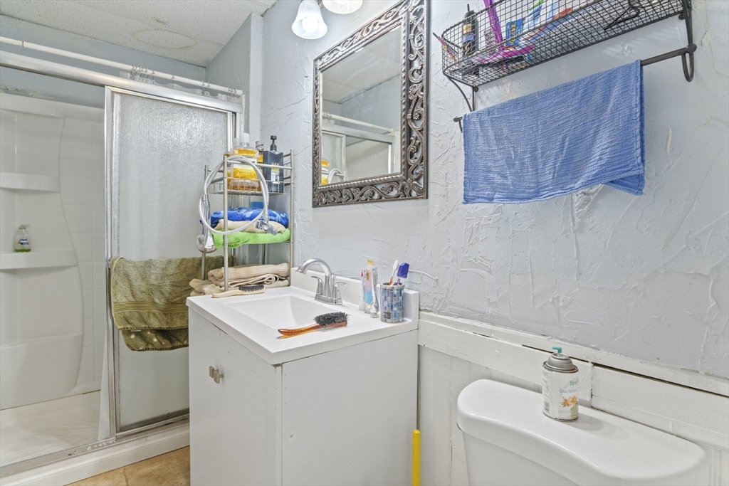 78 Greenwood Street Worcester, MA 01607 - Photo 29 of 33 a bathroom with a sink and a mirror