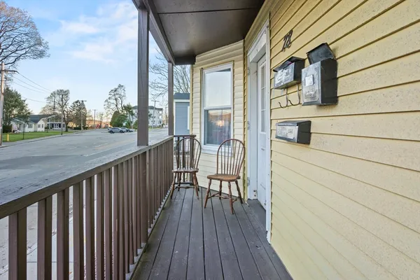 a view of a balcony with wooden floor