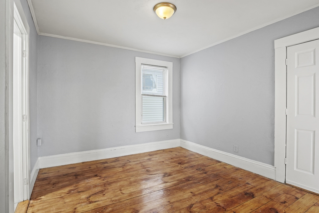 78 Greenwood Street Worcester, MA 01607 - Photo 5 of 33 a view of empty room with wooden floor and fan