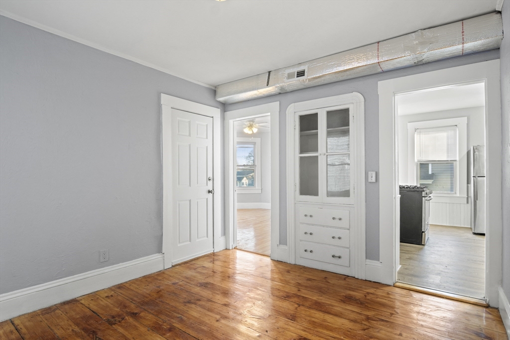 78 Greenwood Street Worcester, MA 01607 - Photo 8 of 33 a view of an empty room with window and wooden floor