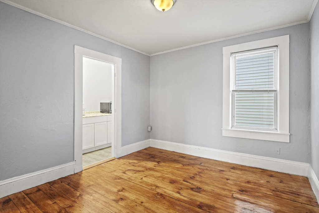 78 Greenwood Street Worcester, MA 01607 - Photo 10 of 33 a view of empty room with wooden floor and fan