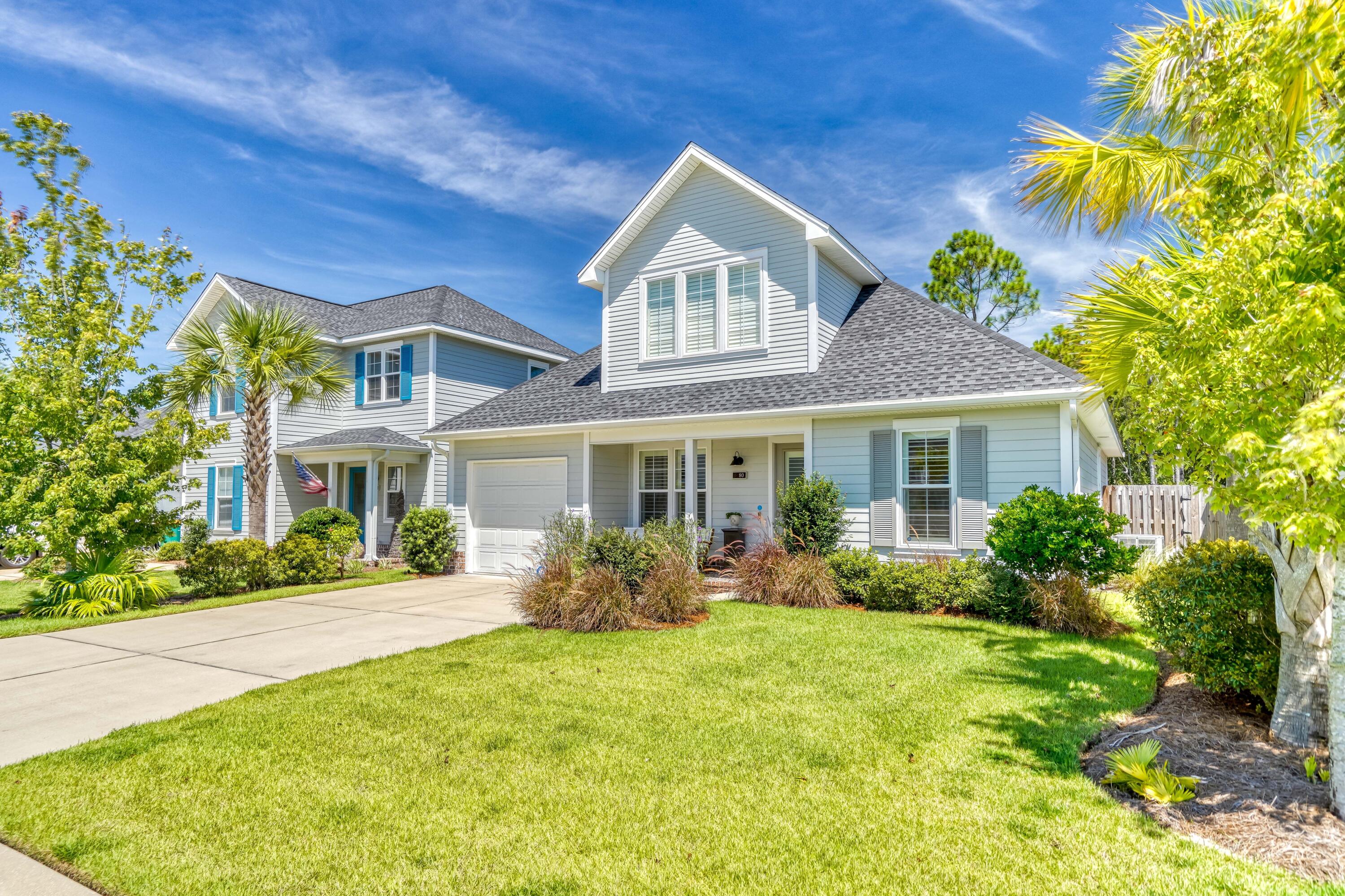 80 North Zander Way Santa Rosa Beach, FL 32459 - Photo 2 of 49 a front view of a house with garden