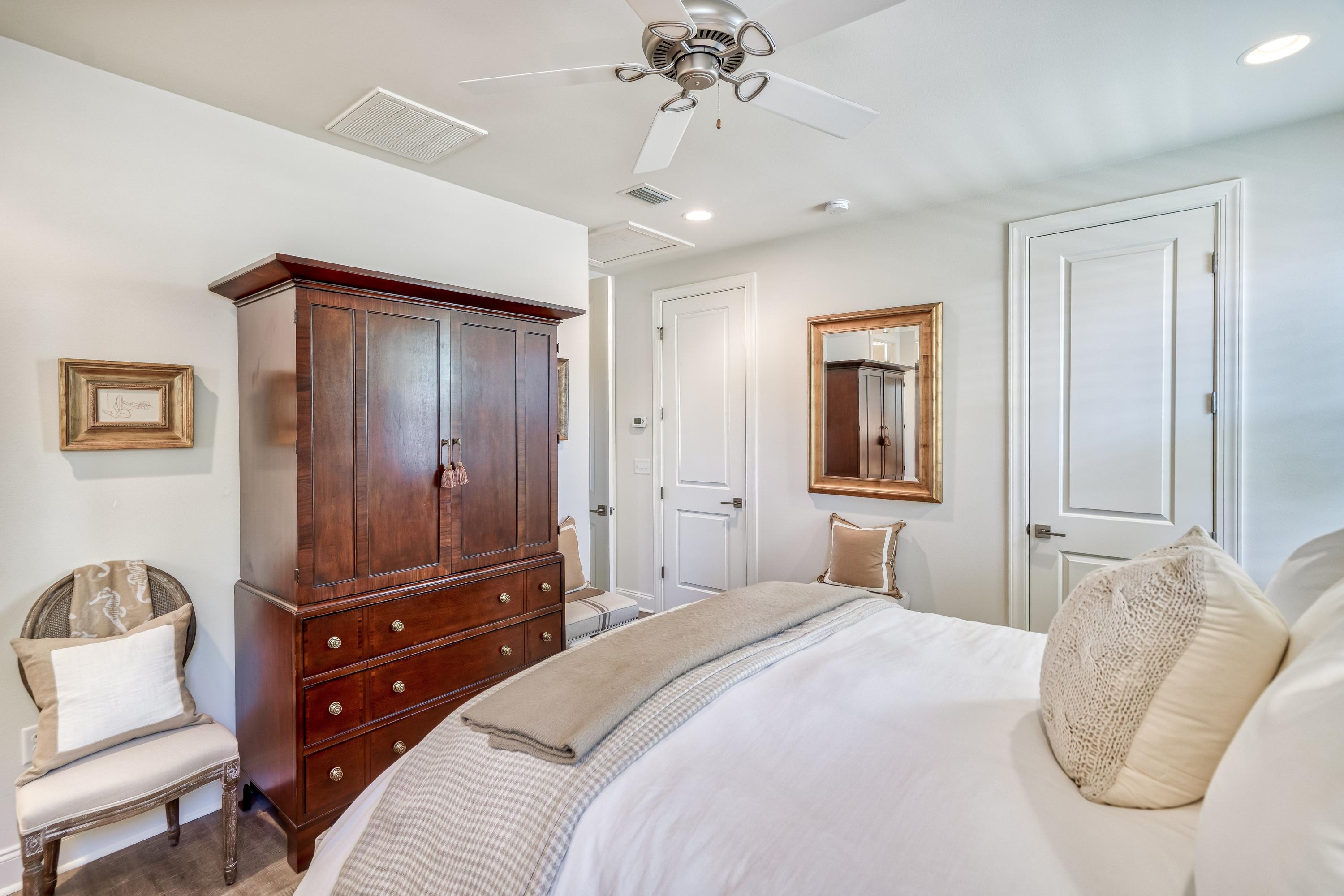 80 North Zander Way Santa Rosa Beach, FL 32459 - Photo 12 of 49 a bedroom with a bed and wooden floor