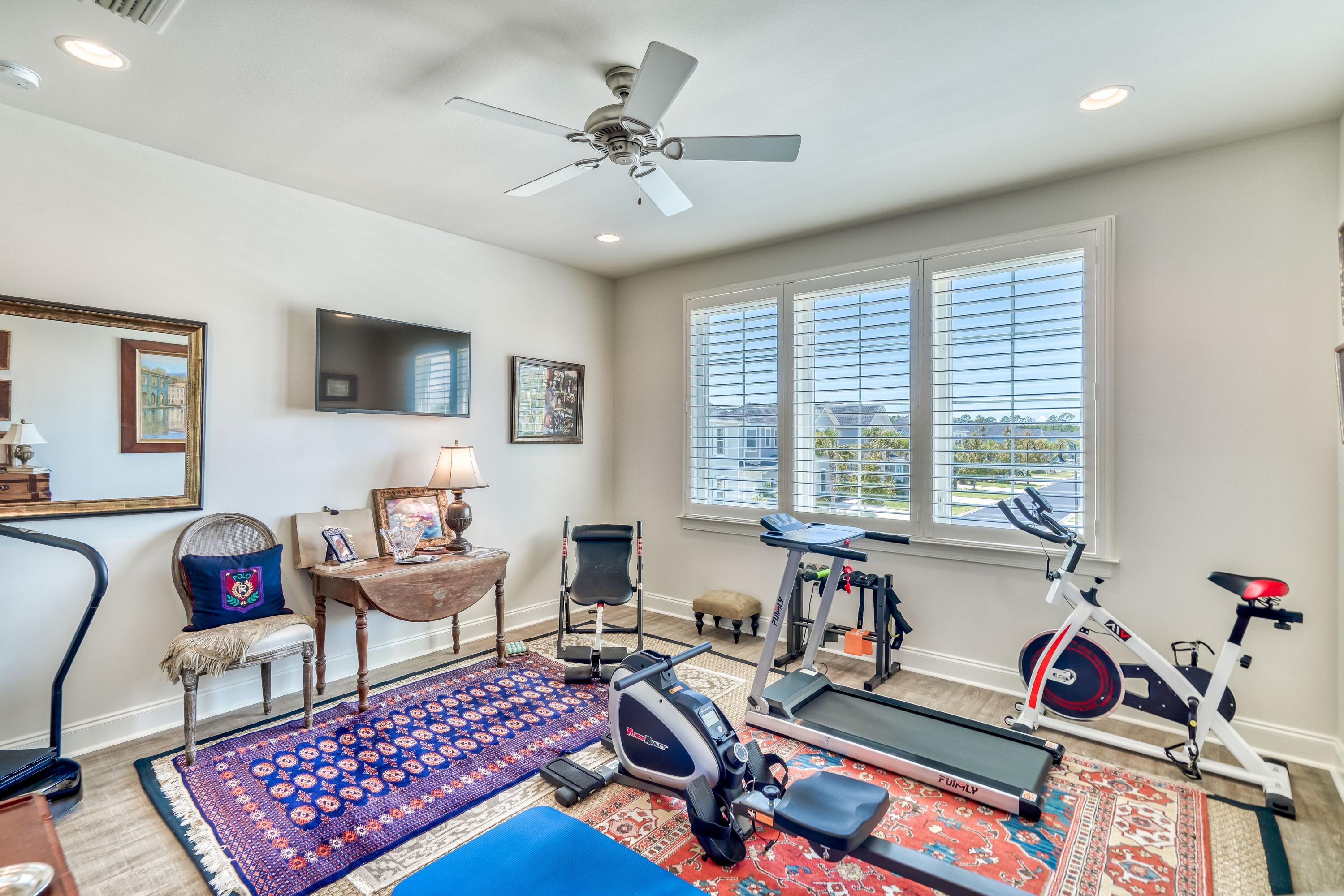 80 North Zander Way Santa Rosa Beach, FL 32459 - Photo 15 of 49 a living room with furniture and a flat screen tv