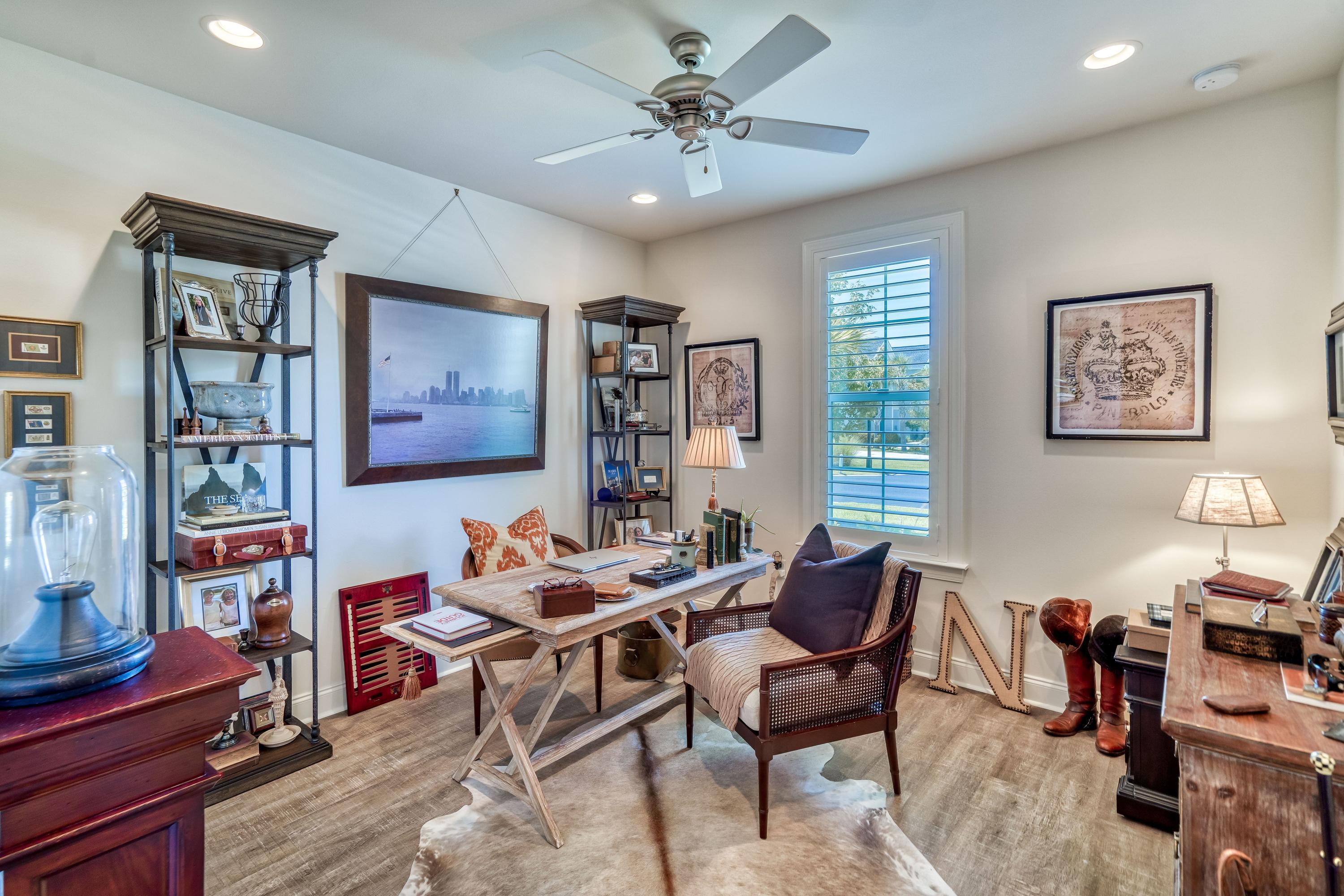 80 North Zander Way Santa Rosa Beach, FL 32459 - Photo 16 of 49 a living room with furniture a bookshelf and a window