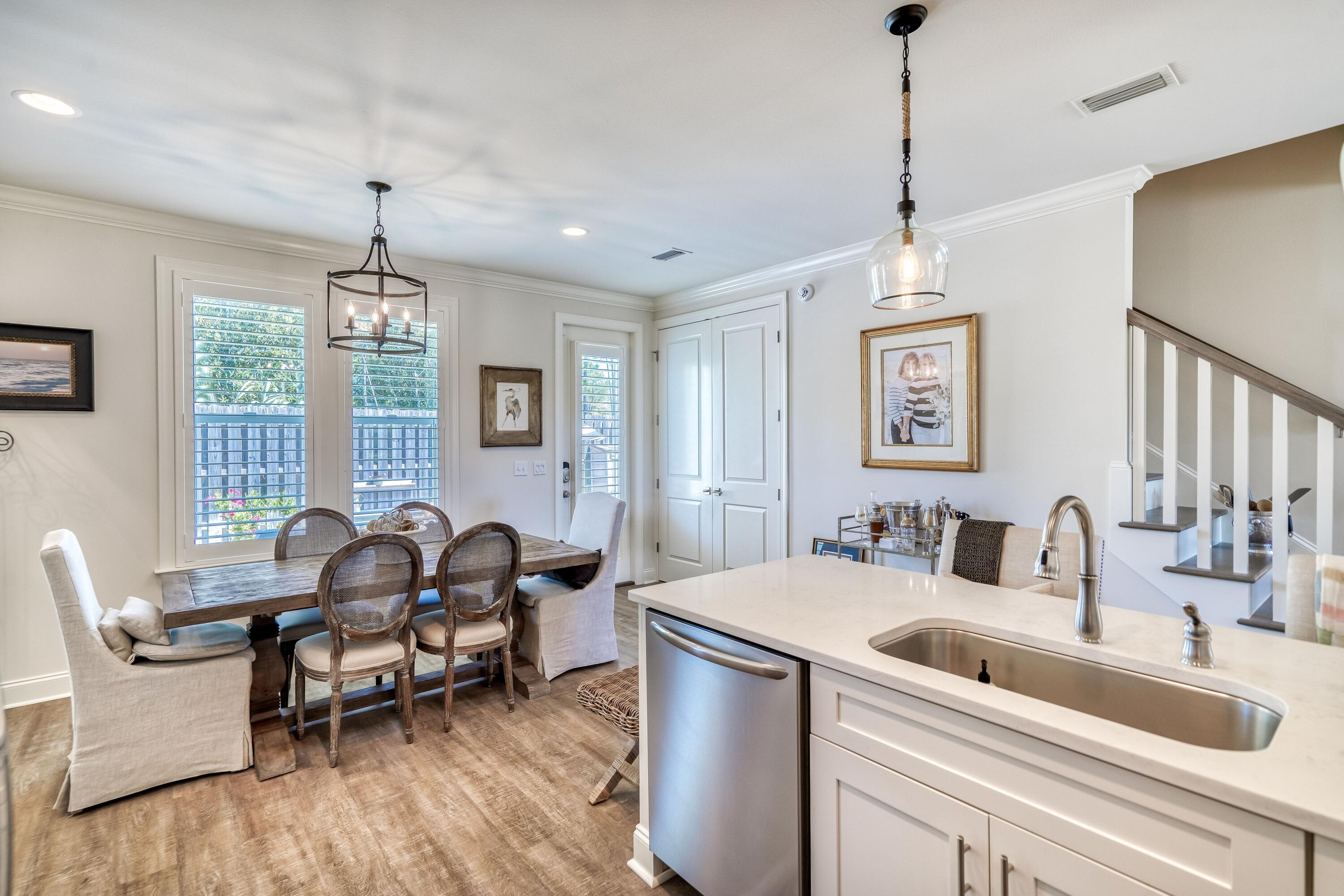 80 North Zander Way Santa Rosa Beach, FL 32459 - Photo 26 of 49 a dining room with furniture and window