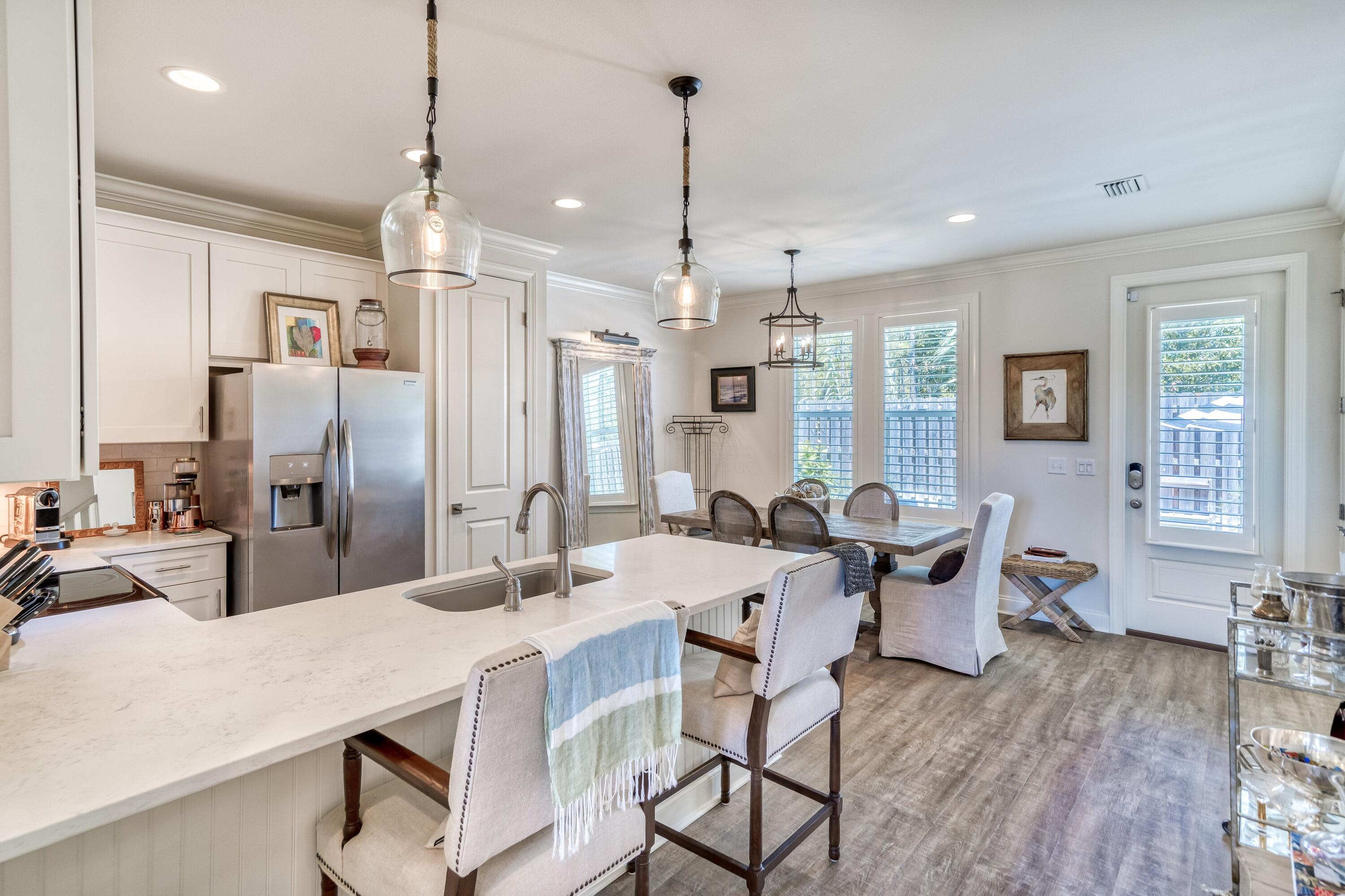 80 North Zander Way Santa Rosa Beach, FL 32459 - Photo 28 of 49 a large kitchen with a table and chairs
