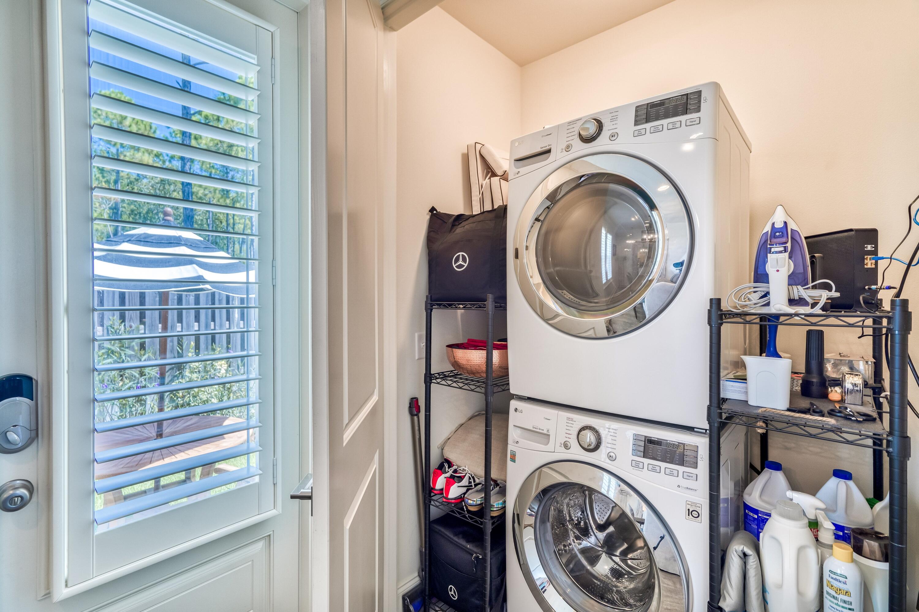 80 North Zander Way Santa Rosa Beach, FL 32459 - Photo 29 of 49 a view of a storage and utility room with washer and dryer