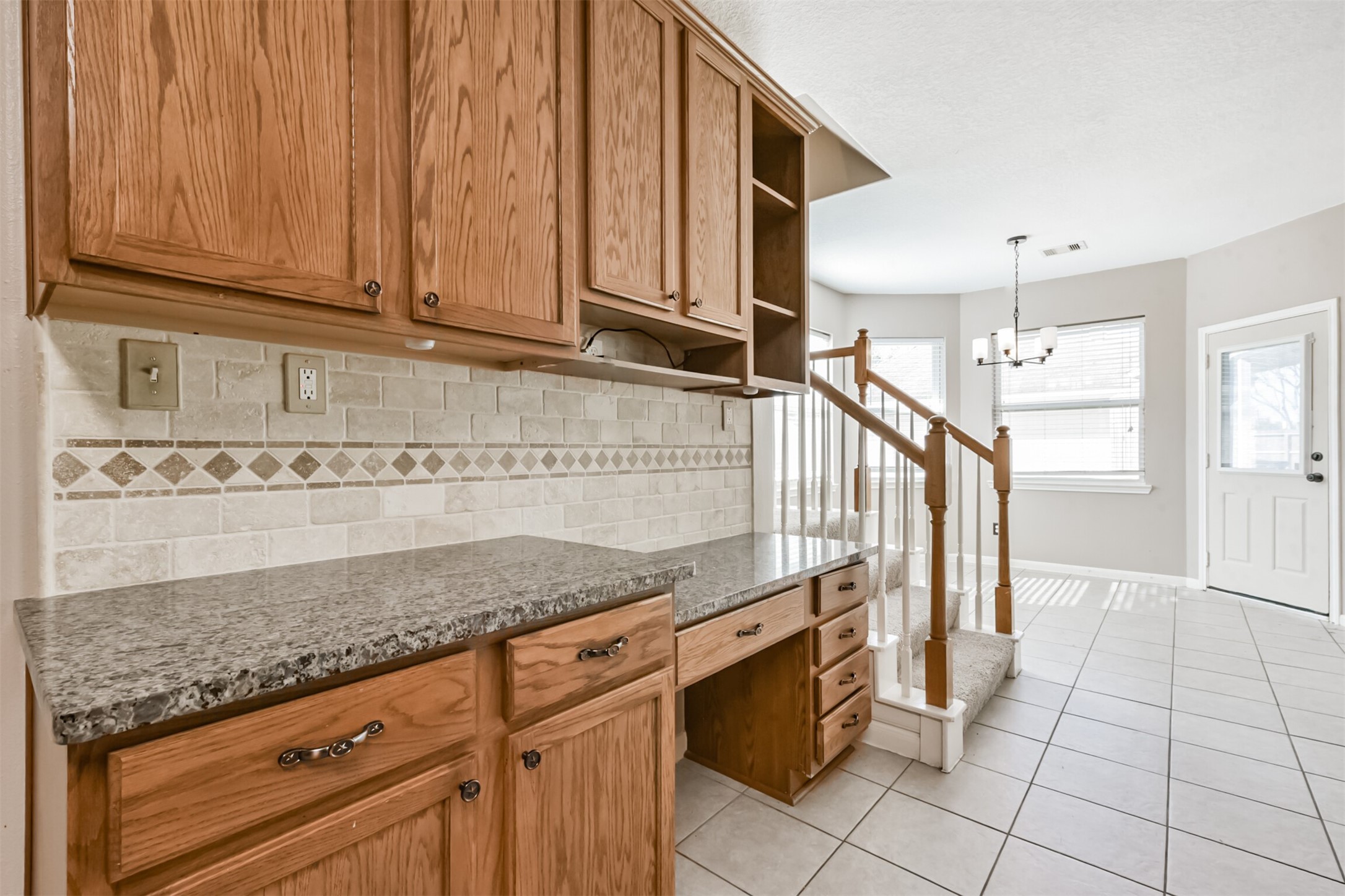 3919 Copper Creek Baytown, TX 77521 - Photo 15 of 50 a kitchen with granite countertop a sink and cabinets