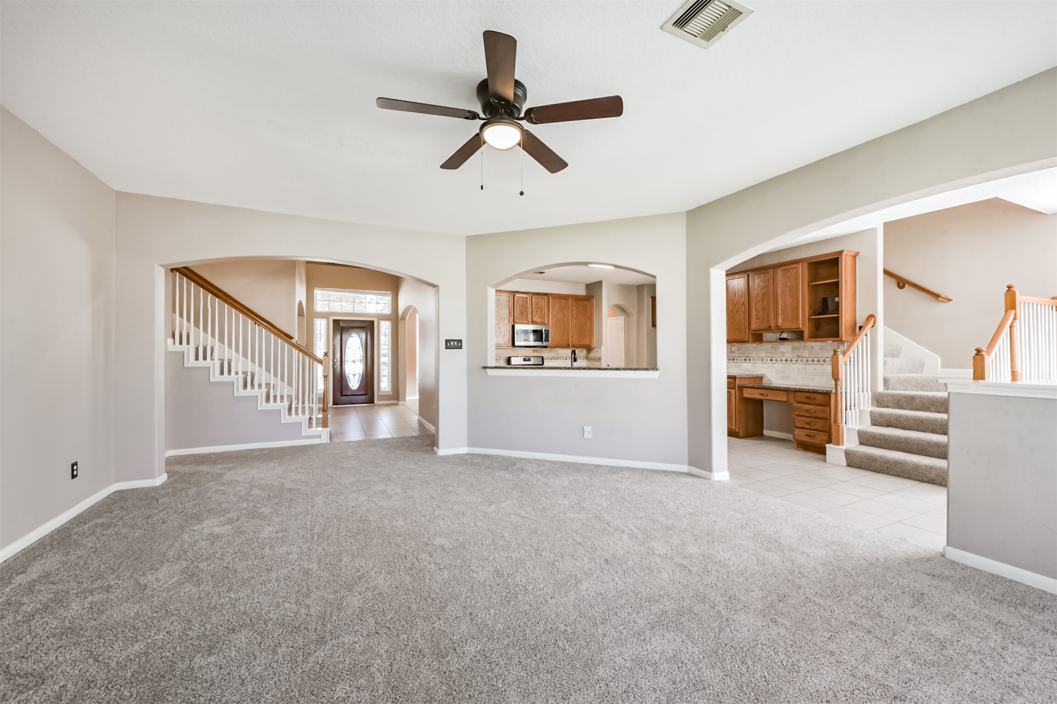 3919 Copper Creek Baytown, TX 77521 - Photo 18 of 50 a view of a livingroom with an empty space and a ceiling fan