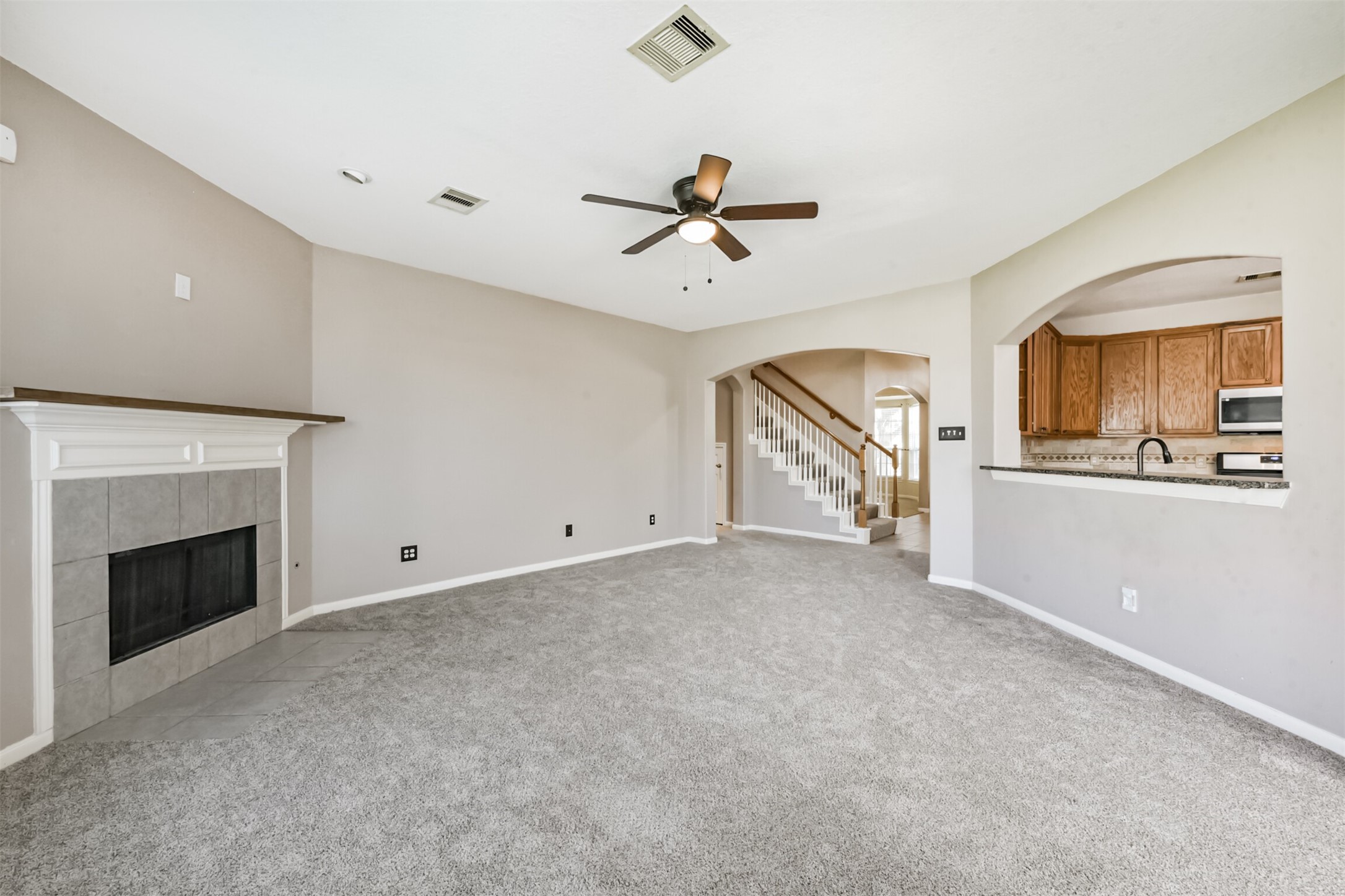 3919 Copper Creek Baytown, TX 77521 - Photo 20 of 50 a view of a livingroom with an empty kitchen and a fireplace