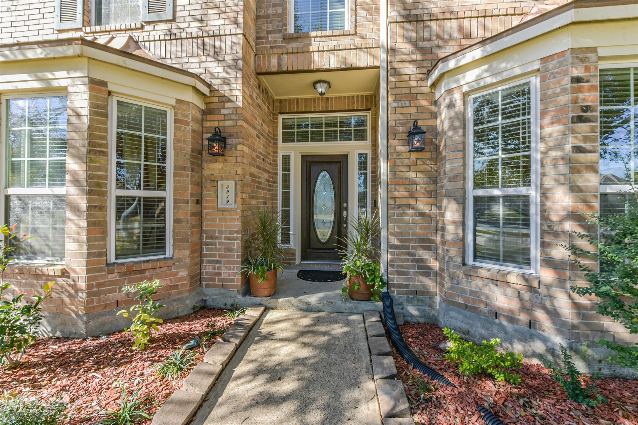 3919 Copper Creek Baytown, TX 77521 - Photo 2 of 50 a front view of a house with a yard