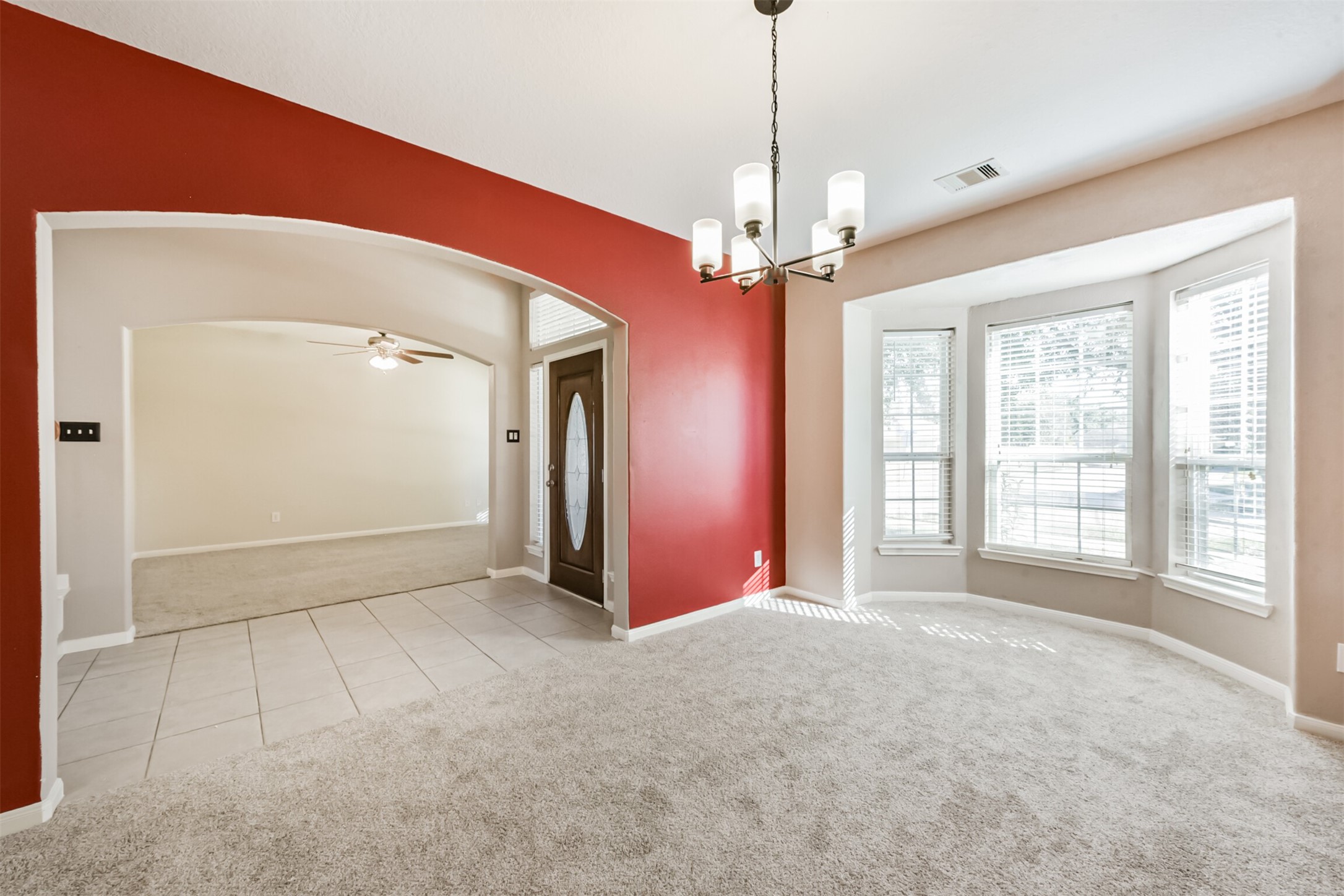 3919 Copper Creek Baytown, TX 77521 - Photo 22 of 50 a view of a livingroom with a chandelier fan and windows