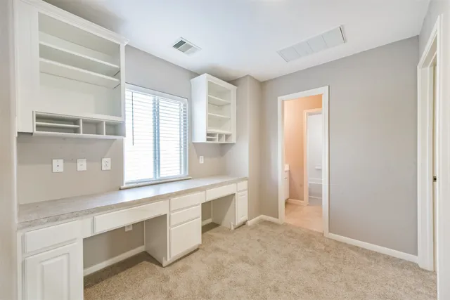 a view of a kitchen cabinets a sink and a window