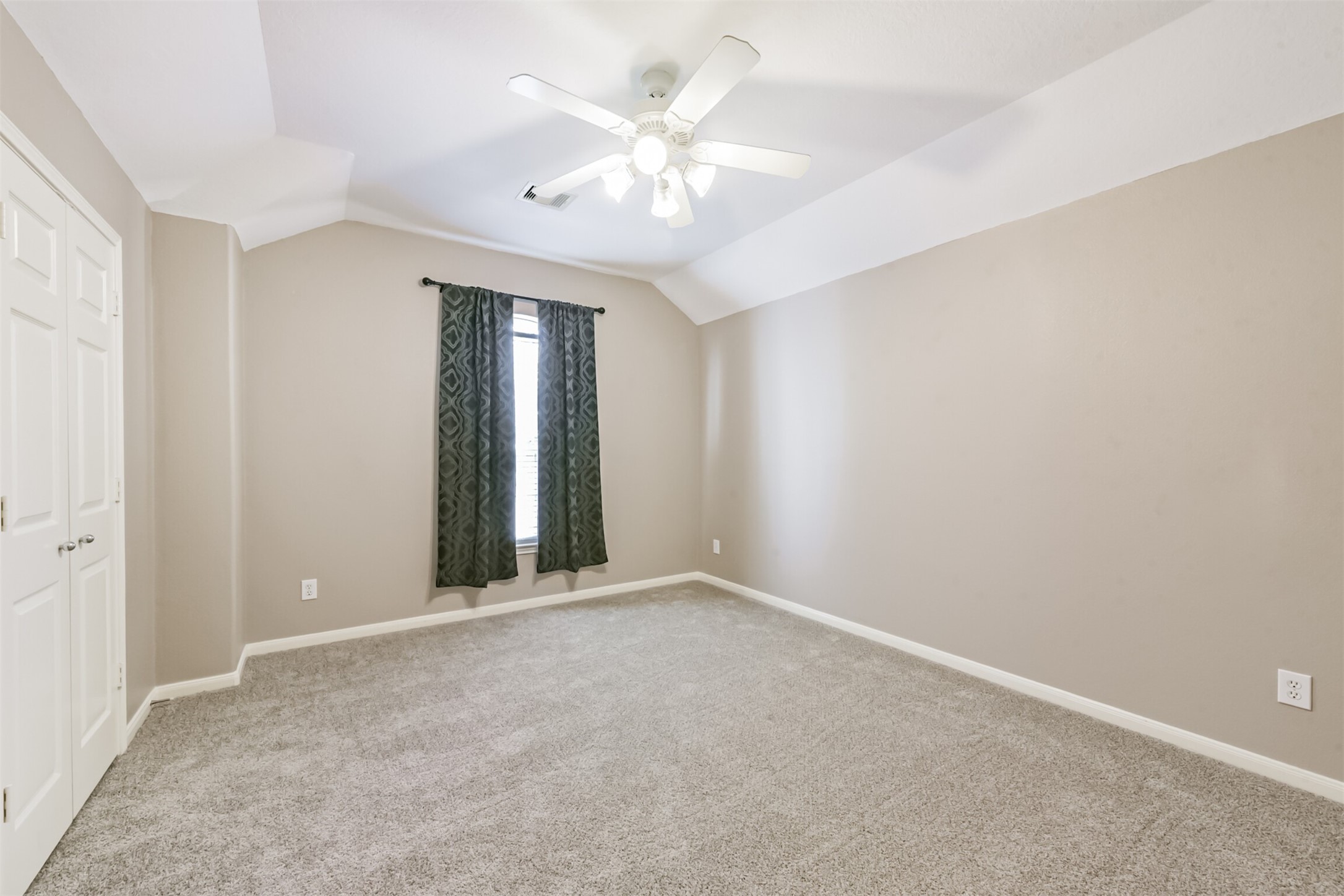 3919 Copper Creek Baytown, TX 77521 - Photo 34 of 50 an empty room with fan and windows
