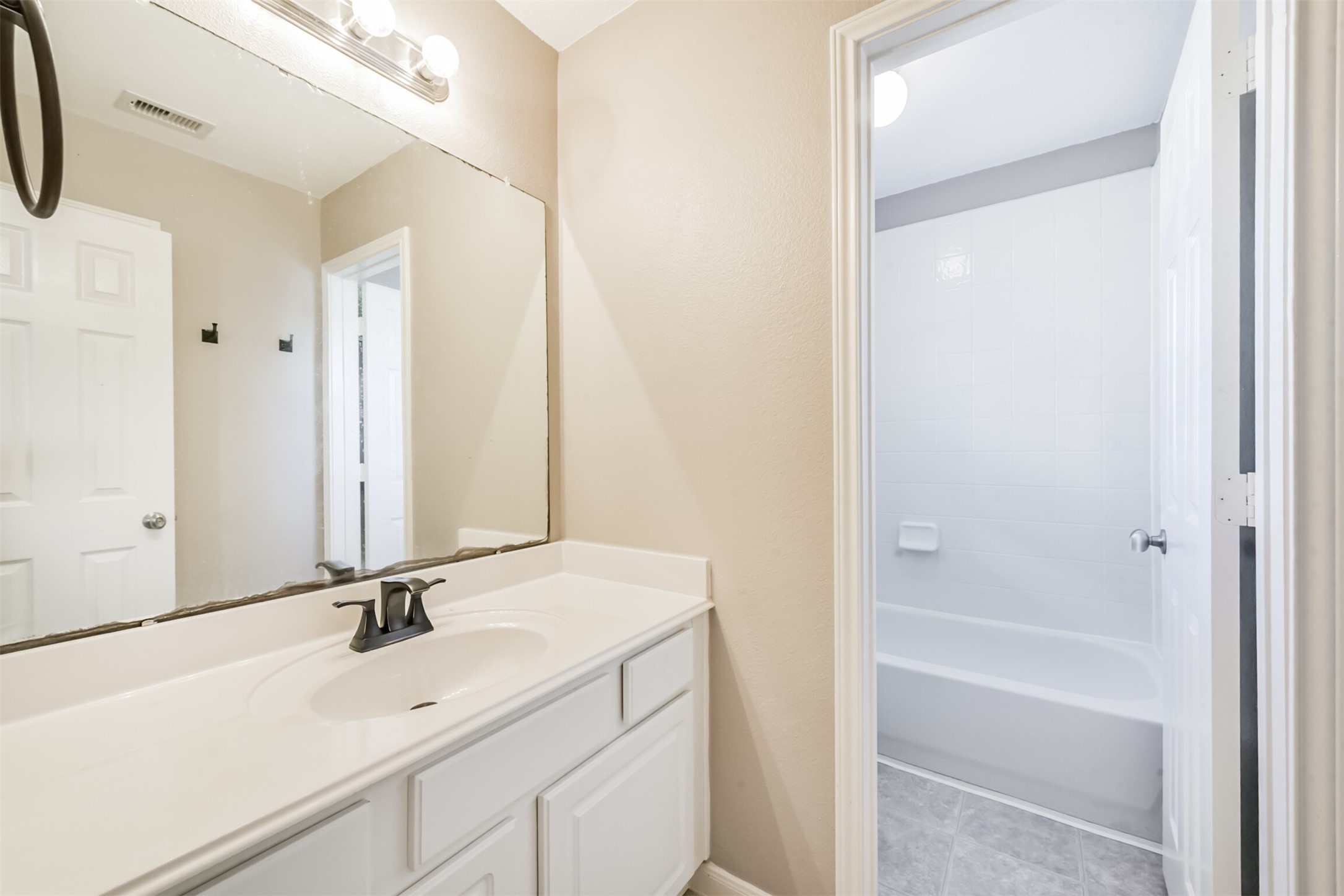 3919 Copper Creek Baytown, TX 77521 - Photo 40 of 50 a bathroom with a sink and a mirror