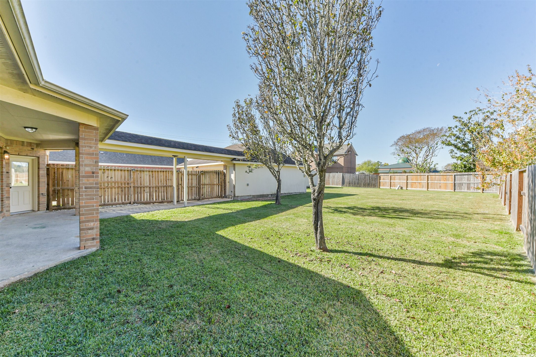 3919 Copper Creek Baytown, TX 77521 - Photo 46 of 50 a view of an house with backyard space and deck