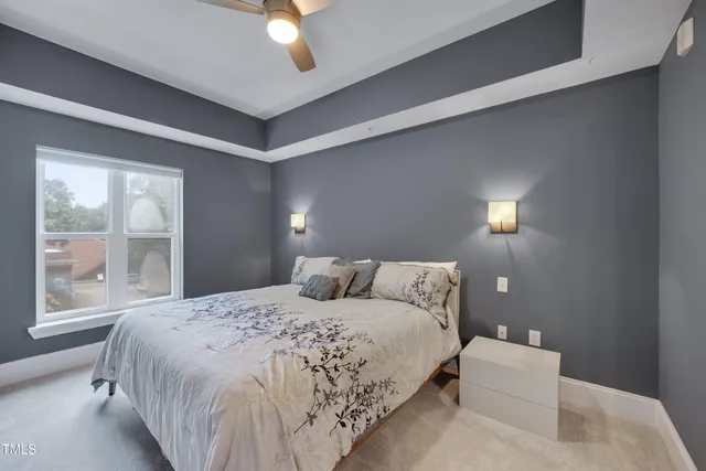 a bedroom with a bed and window