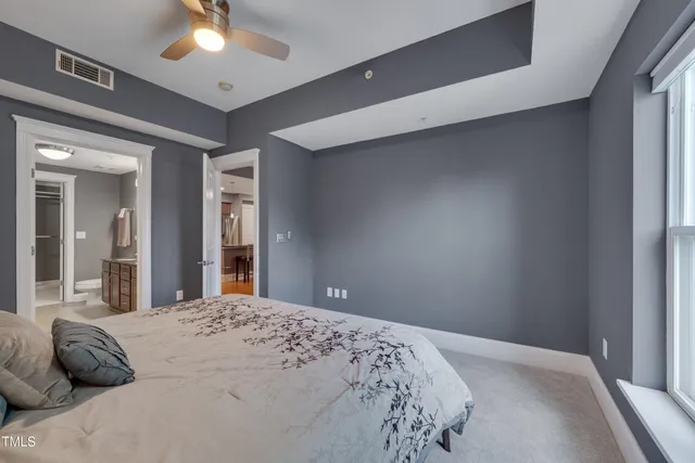 a bedroom with a bed and window