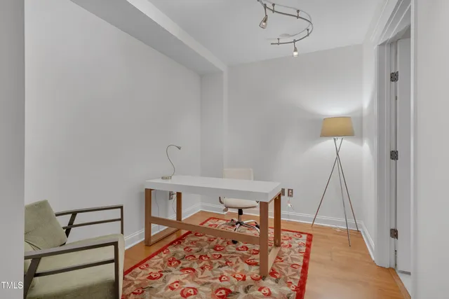 a bedroom with a bed and a table