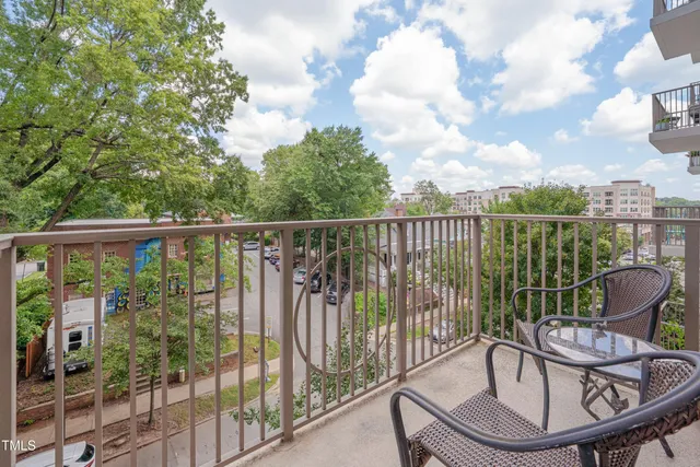 a view of a balcony with furniture